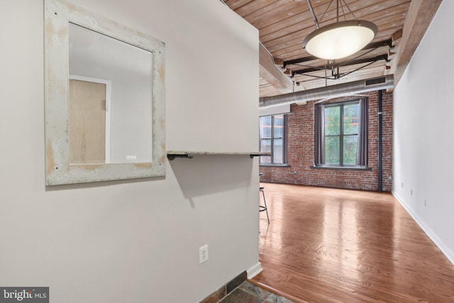 1147 N 4th St Unit 2E, Philadelphia, PA 19123 - empty room featuring brick wall, wood ceiling, and wood finished floors