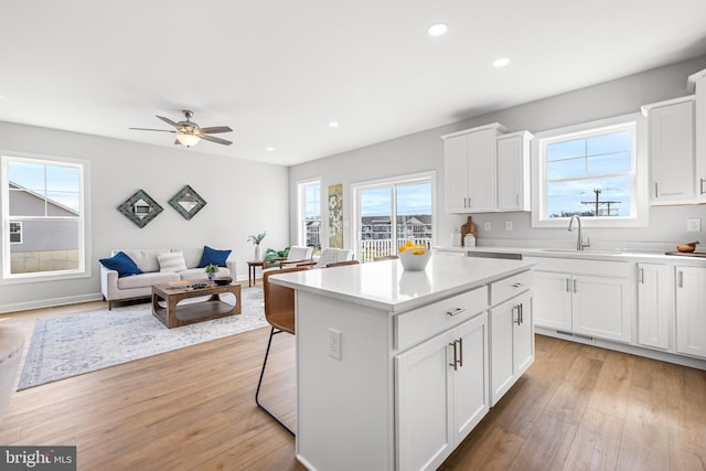 256 Ridge View Ln Unit 41, Hanover, PA 17331 - kitchen with a sink, light wood-style flooring, a kitchen island, recessed lighting, and light countertops