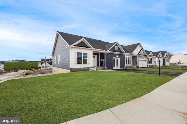256 Ridge View Ln Unit 41, Hanover, PA 17331 - view of front of home with french doors, a front lawn, driveway, and roof with shingles
