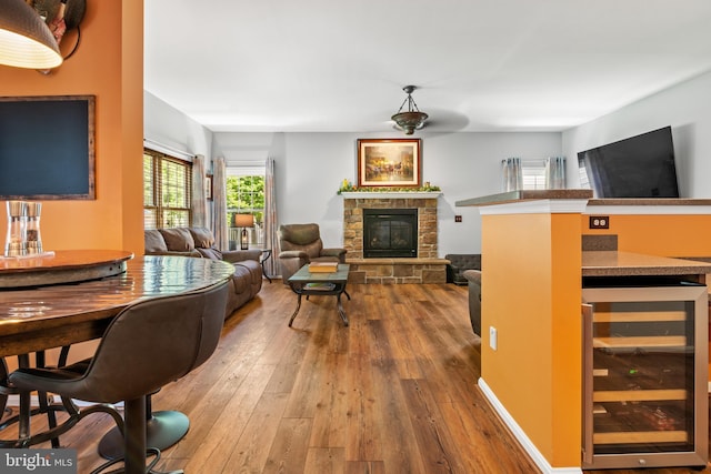 1209 Stevenage Ct, Abingdon, MD 21009 - living room with beverage cooler, wood-type flooring, and a fireplace