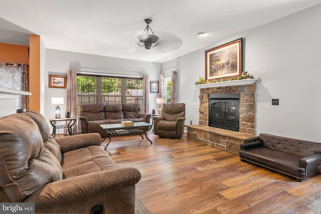 1209 Stevenage Ct, Abingdon, MD 21009 - living room featuring a ceiling fan, a fireplace, and hardwood / wood-style flooring