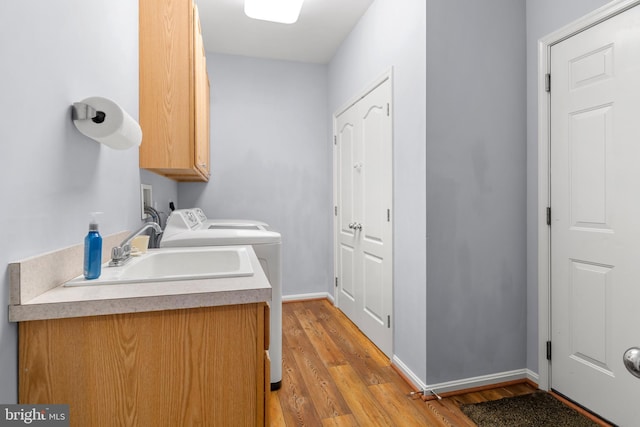 1209 Stevenage Ct, Abingdon, MD 21009 - laundry area with cabinet space, light wood-style flooring, independent washer and dryer, and baseboards