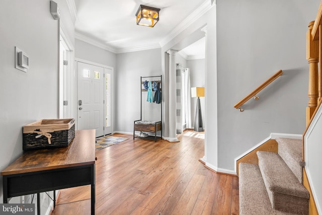 1209 Stevenage Ct, Abingdon, MD 21009 - entryway with decorative columns, hardwood / wood-style floors, stairs, baseboards, and ornamental molding