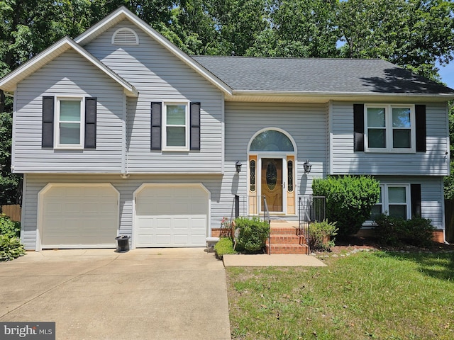 10603 Eden Brook Dr, Spotsylvania, VA 22553 - bi-level home featuring driveway, an attached garage, a front yard, and a shingled roof