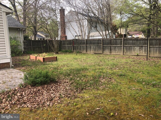 9513 Snowbird Rd, Chesterfield, VA 23832 - view of yard with a vegetable garden
