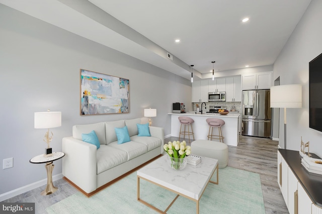 832 19th St NE Unit B, Washington, DC 20002 - living area featuring light wood-type flooring, baseboards, and recessed lighting