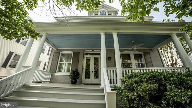 209 N Water St, Chestertown, MD 21620 - doorway to property featuring covered porch, ceiling fan, and french doors