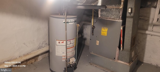 218 Stroud St, Wilmington, DE 19805 - utility room featuring gas water heater and heating unit