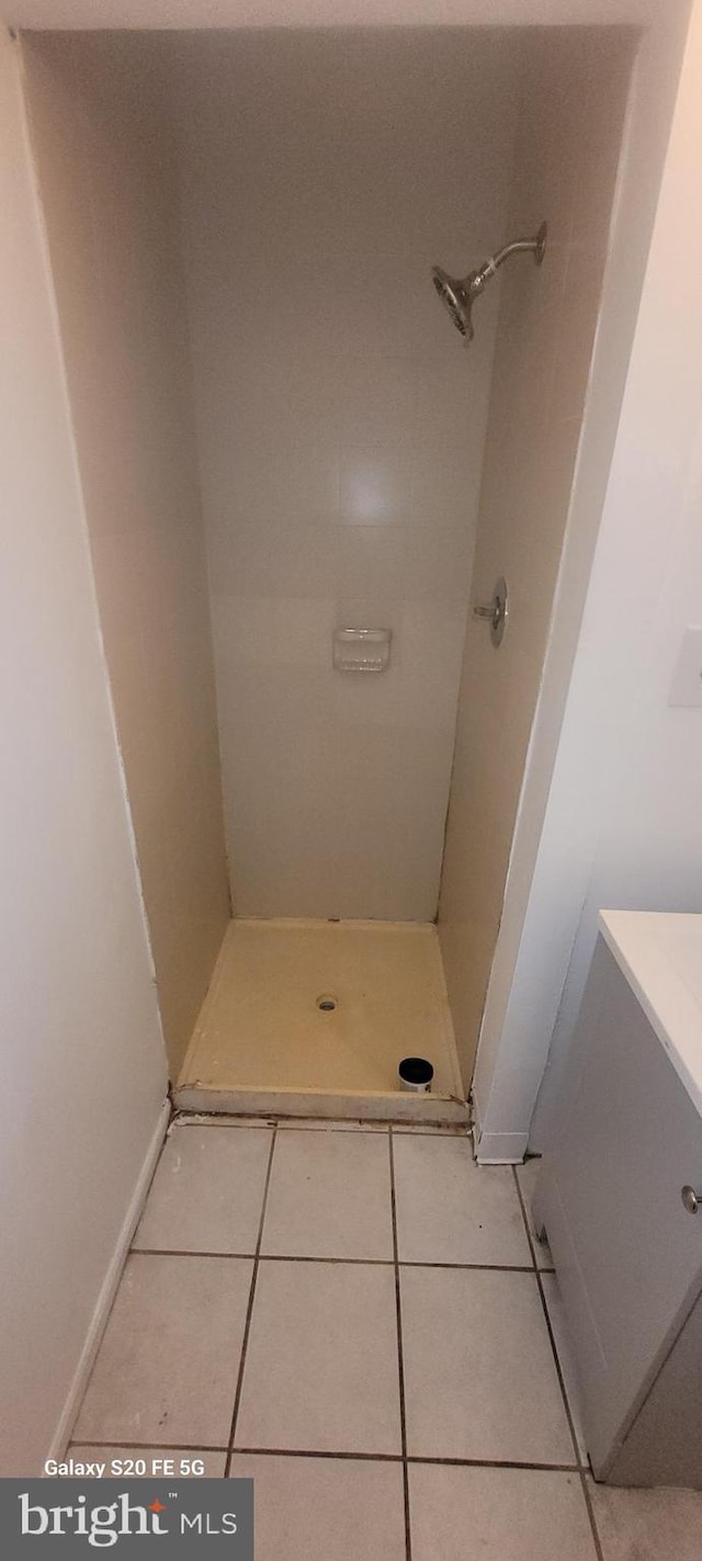 218 Stroud St, Wilmington, DE 19805 - bathroom featuring tile patterned floors, vanity, and a stall shower