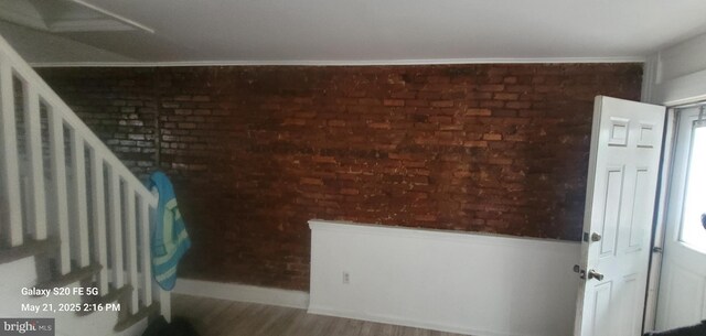 218 Stroud St, Wilmington, DE 19805 - entrance foyer with brick wall and wood finished floors