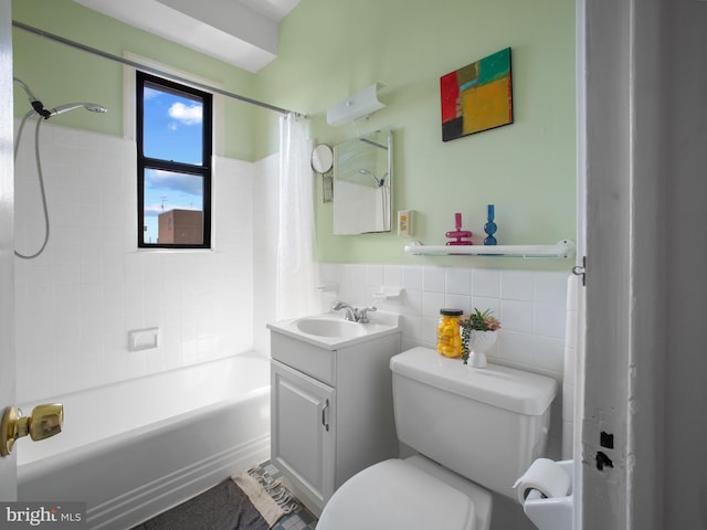 2515 K St NW Unit 807, Washington, DC 20037 - full bath featuring tile walls, vanity, shower / bath combo, toilet, and a wainscoted wall