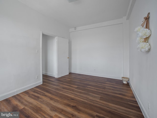 2515 K St NW Unit 807, Washington, DC 20037 - empty room with dark wood-type flooring and baseboards