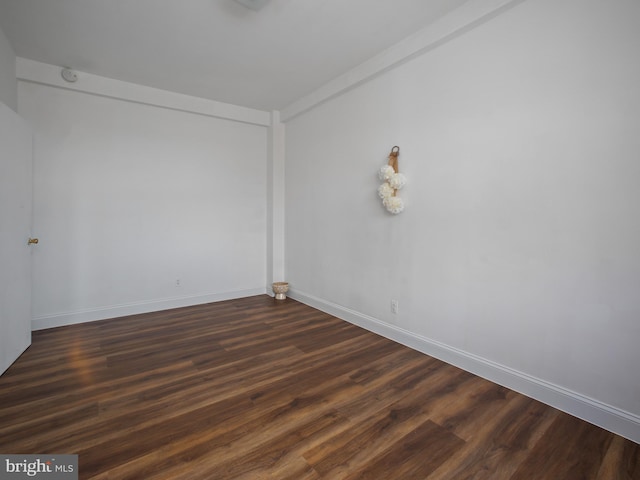 2515 K St NW Unit 807, Washington, DC 20037 - spare room with dark wood-style flooring and baseboards