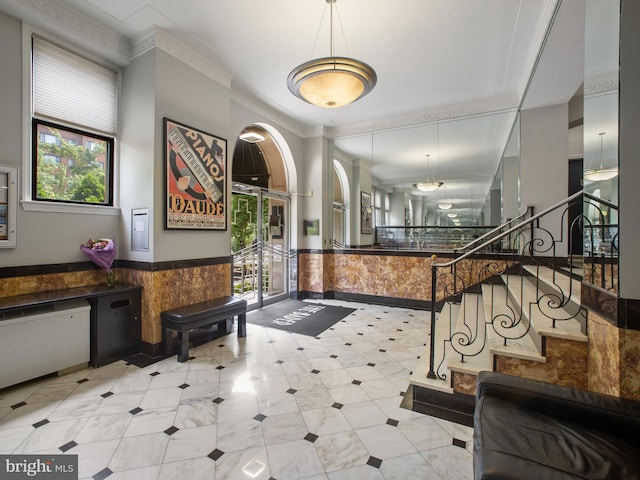 2515 K St NW Unit 807, Washington, DC 20037 - entryway featuring a wainscoted wall, stairway, and ornamental molding
