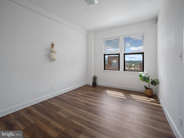 2515 K St NW Unit 807, Washington, DC 20037 - spare room with dark wood-type flooring and baseboards