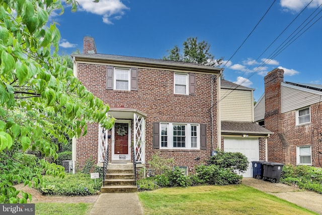 4208 Longfellow St, Hyattsville, MD 20781 - view of front of property featuring brick siding, a chimney, a garage, and a front yard