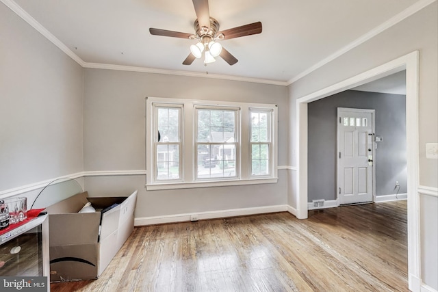 4208 Longfellow St, Hyattsville, MD 20781 - foyer featuring ceiling fan, wood finished floors, and crown molding