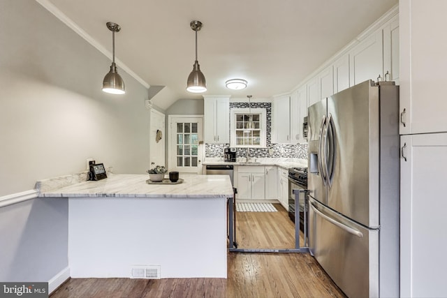 4208 Longfellow St, Hyattsville, MD 20781 - kitchen featuring stainless steel refrigerator with ice dispenser, a peninsula, white cabinets, and light wood-style floors