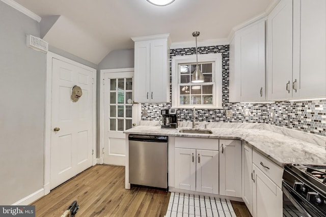 4208 Longfellow St, Hyattsville, MD 20781 - kitchen with dishwasher, light wood-style flooring, tasteful backsplash, gas stove, and crown molding