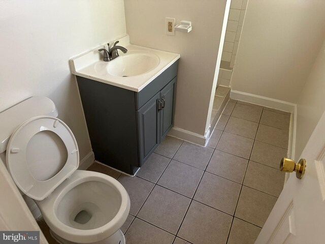 120 Danbury St SW Unit 120-C, Washington, DC 20032 - bathroom featuring toilet, tile patterned flooring, vanity, and baseboards
