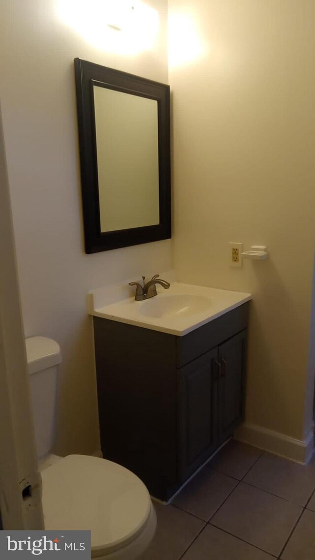 120 Danbury St SW Unit 120-C, Washington, DC 20032 - bathroom with toilet, vanity, tile patterned floors, and baseboards