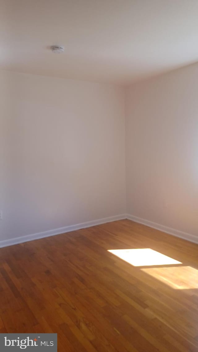 120 Danbury St SW Unit 120-C, Washington, DC 20032 - empty room with wood finished floors and baseboards