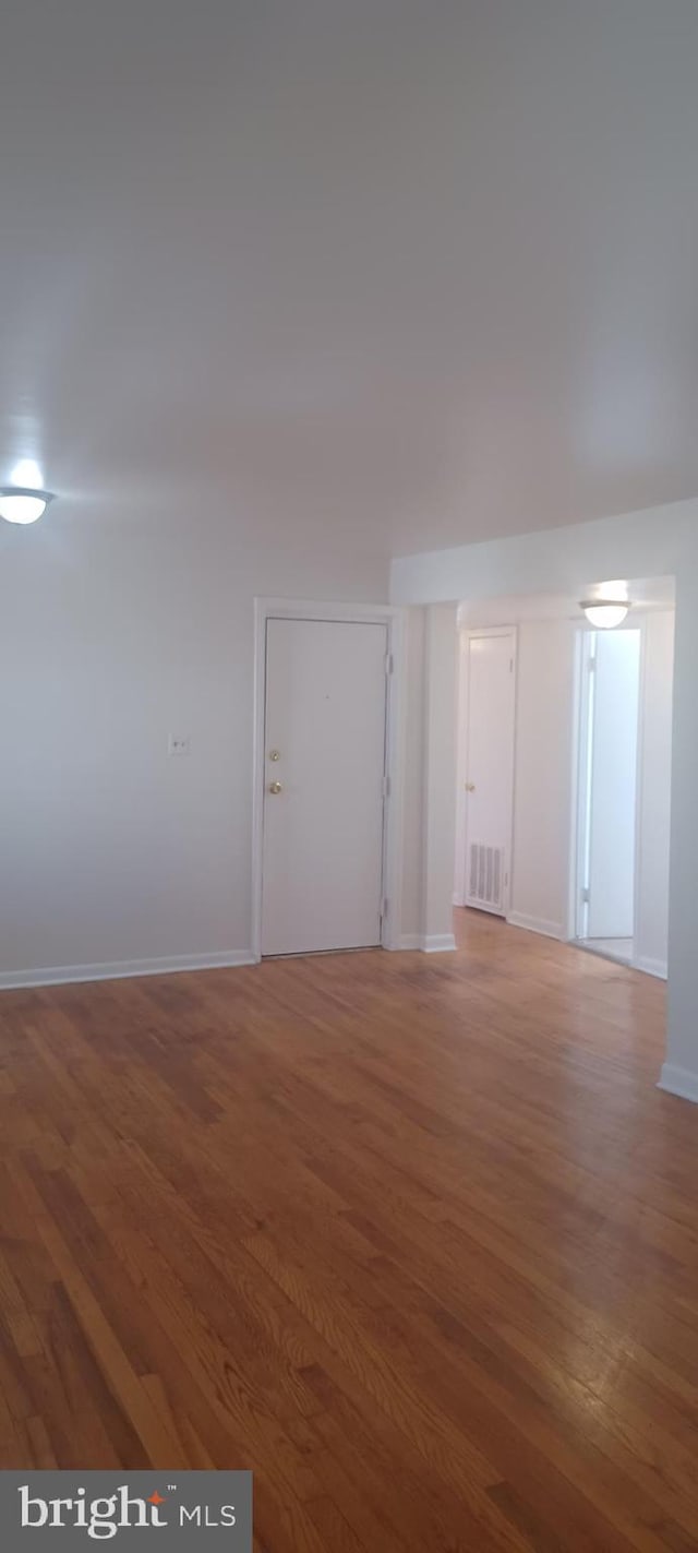 120 Danbury St SW Unit 120-C, Washington, DC 20032 - unfurnished room with wood finished floors and baseboards