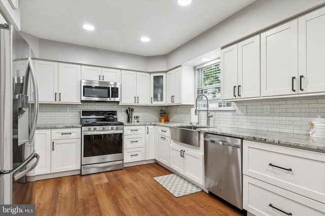3708 Swetland Dr, Doylestown, PA 18902 - kitchen with appliances with stainless steel finishes, a sink, white cabinets, and recessed lighting