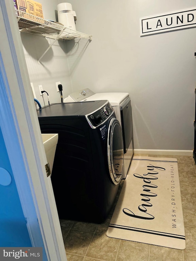 99 Berkley Rd, Reading, PA 19605 - laundry area featuring washer and clothes dryer, baseboards, and light tile patterned flooring