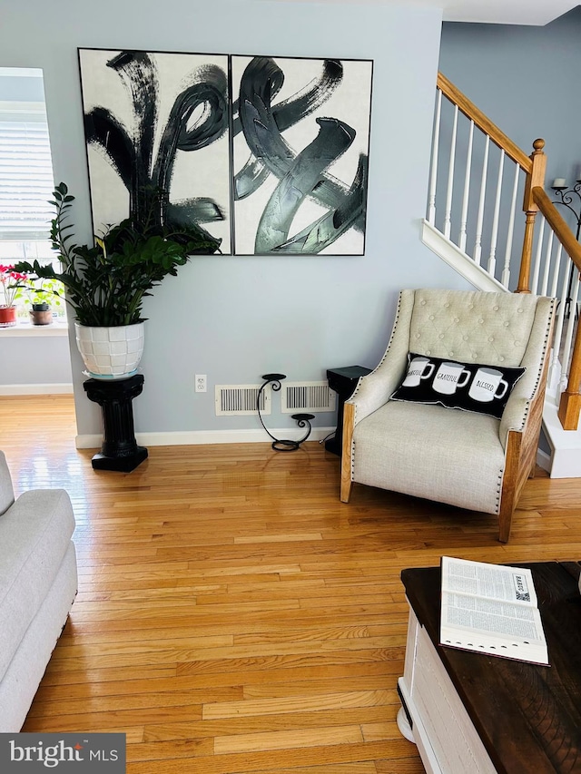 99 Berkley Rd, Reading, PA 19605 - sitting room with baseboards, light wood finished floors, and stairs