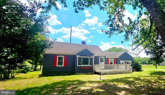 30292 Vines Creek Rd, Dagsboro, DE 19939 - rear view of property with a deck, a lawn, and a chimney