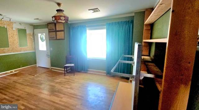 30292 Vines Creek Rd, Dagsboro, DE 19939 - unfurnished bedroom featuring multiple windows, wood finished floors, ornamental molding, and baseboards