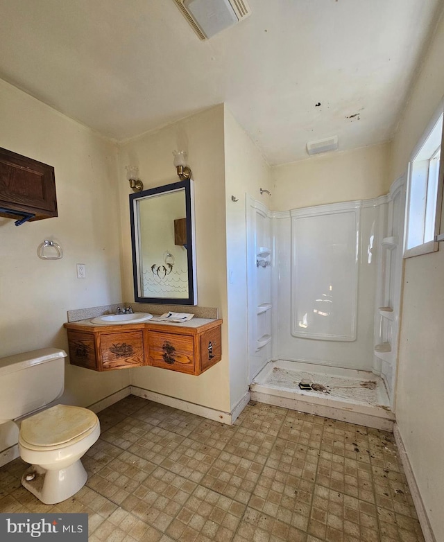 30292 Vines Creek Rd, Dagsboro, DE 19939 - bathroom featuring toilet, baseboards, a shower stall, and vanity