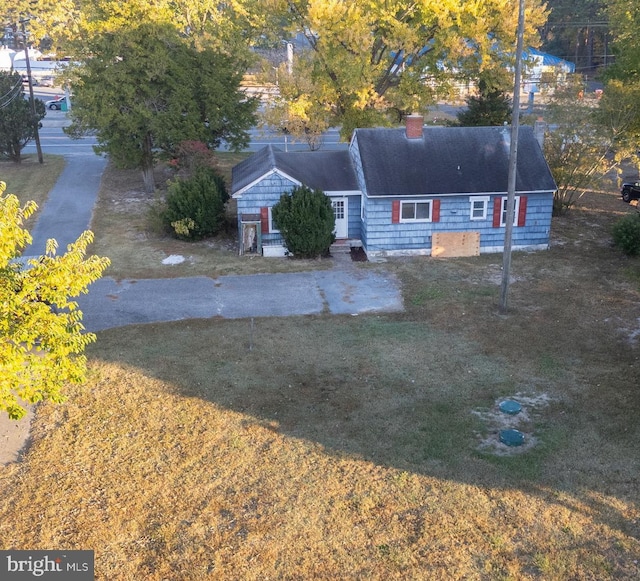 30292 Vines Creek Rd, Dagsboro, DE 19939 - view of front of house with a chimney and a front yard