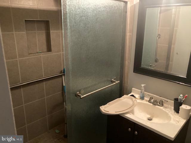 3121 University Blvd W Unit 3, Kensington, MD 20895 - full bath featuring vanity and a tile shower