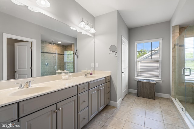 409 Pear Blossom Rd, Stafford, VA 22554 - full bathroom featuring double vanity, a shower stall, baseboards, and tile patterned flooring