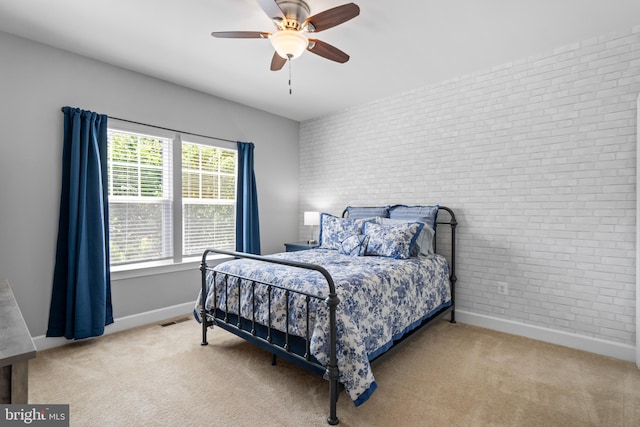 409 Pear Blossom Rd, Stafford, VA 22554 - carpeted bedroom with brick wall, baseboards, and ceiling fan
