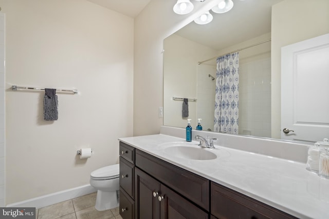 409 Pear Blossom Rd, Stafford, VA 22554 - bathroom featuring toilet, tile patterned flooring, vanity, tiled shower, and baseboards