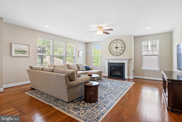 409 Pear Blossom Rd, Stafford, VA 22554 - living area featuring a ceiling fan, dark wood-style floors, baseboards, a fireplace with flush hearth, and recessed lighting
