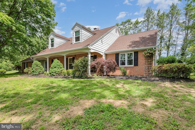 4210 Mcintosh Rd, Harrisburg, PA 17112 - cape cod-style house featuring brick siding, a front lawn, and roof with shingles
