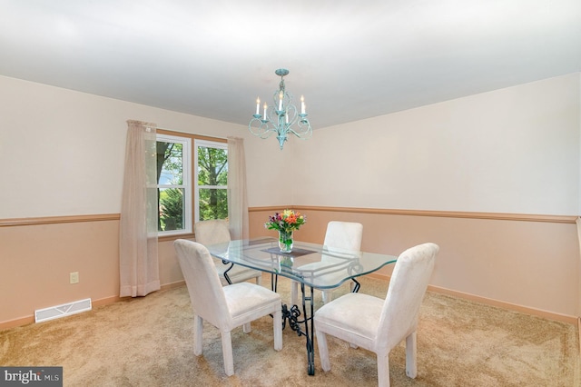 4210 Mcintosh Rd, Harrisburg, PA 17112 - carpeted dining room with a chandelier and baseboards