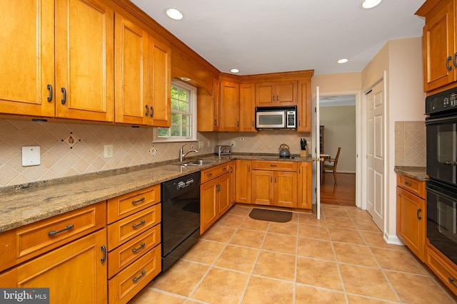 108 Holiday St, Mount Laurel, NJ 08054 - kitchen featuring black dishwasher, stainless steel microwave, a sink, brown cabinets, and backsplash