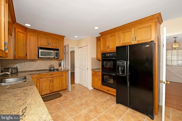 108 Holiday St, Mount Laurel, NJ 08054 - kitchen featuring black appliances, a sink, decorative backsplash, brown cabinets, and light tile patterned flooring