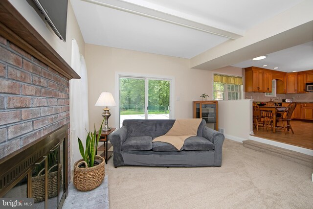 108 Holiday St, Mount Laurel, NJ 08054 - living area featuring light colored carpet, beam ceiling, a brick fireplace, and recessed lighting