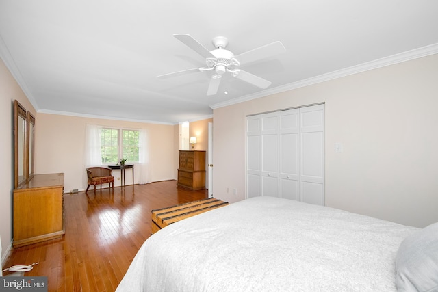108 Holiday St, Mount Laurel, NJ 08054 - bedroom with ornamental molding, wood finished floors, a closet, and ceiling fan