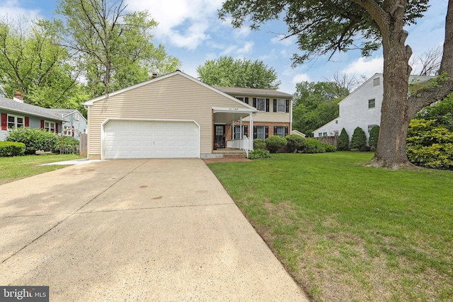 108 Holiday St, Mount Laurel, NJ 08054 - view of front facade with a front lawn, an attached garage, concrete driveway, and a porch