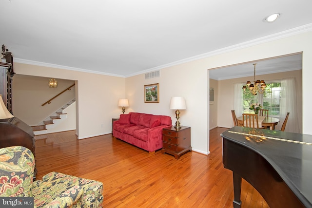 108 Holiday St, Mount Laurel, NJ 08054 - living room featuring stairs, a chandelier, light wood-style floors, crown molding, and baseboards