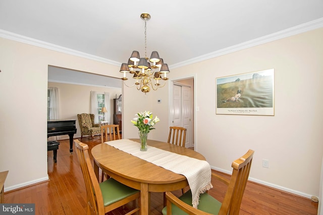 108 Holiday St, Mount Laurel, NJ 08054 - dining area with a chandelier, light wood-style flooring, ornamental molding, and baseboards