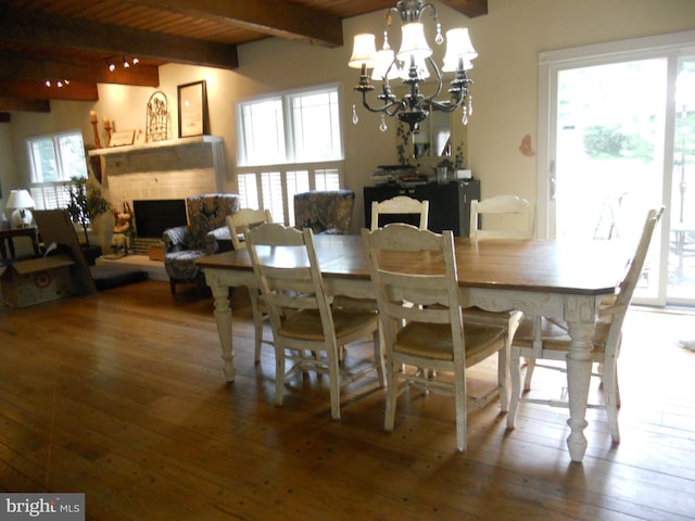 22 Hart Ln, Sewell, NJ 08080 - dining area featuring beamed ceiling, a fireplace, healthy amount of natural light, hardwood / wood-style flooring, and a chandelier