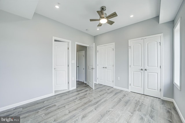 832 19th St NE Unit C, Washington, DC 20002 - unfurnished bedroom with baseboards, light wood-style floors, multiple closets, recessed lighting, and ceiling fan